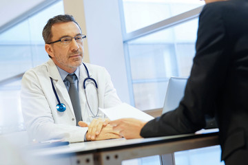 Fototapeta premium Specialist with patient in doctor's office