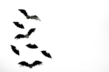 Halloween paper decorations concept. Black paper bats on a white background. Halloween concept.
