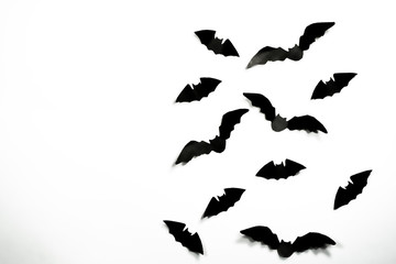 Halloween paper decorations concept. Black paper bats on a white background. Halloween concept.