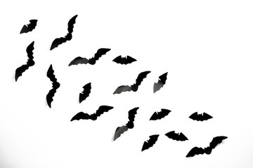 Halloween paper decorations concept. Black paper bats on a white background. Halloween concept.