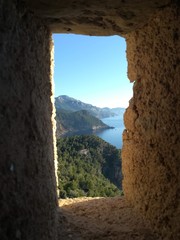 Window facing the mountains next to the sea at Banyalbufar,Mallorca Island.