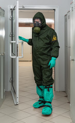 Men in a biohazard protective suit in laboratory. Protection against SARS-CoV-2, Covid-19, 2019-nCoV, SARS-CoV, MERS-CoV, Ebola virus