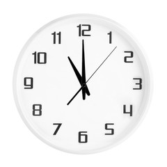 White round office clock showing eleven o'clock isolated on white background. Blank white clock...