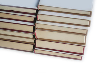 Two stack of books with white covers isolated on white background