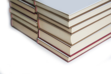 Two stack of books with white covers isolated on white background