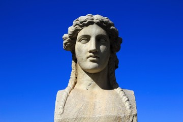 Fototapeta na wymiar Close up of marble statue on the arena of Panathenaic stadium in Athens, Greece