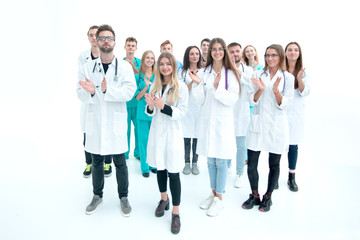 young doctor standing in front of a group of interns