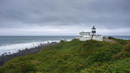 Fototapeta na wymiar Fuguijiao Lighthouse at Cape Fugui northernmost point of Taiwan island