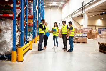 Warehouse staff meeting, workers with mnagers	