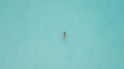 Woman at Lagoon of Seven Colors Lake Bacalar in Mexico