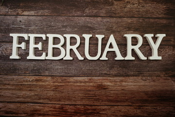February alphabet letters with space copy on wooden background
