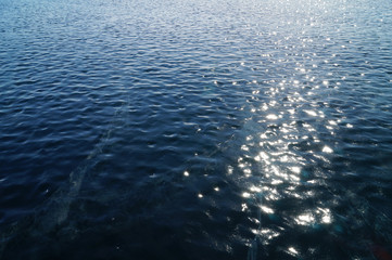 Sunny path on the ice of lake Baikal