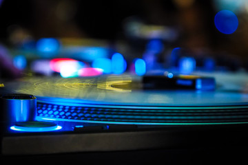 Fototapeta na wymiar DJ vinyl players in dark nightclub, party in the dance club, DJ equipment, defocused