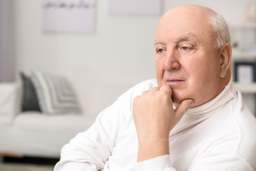 Portrait of elderly man at home