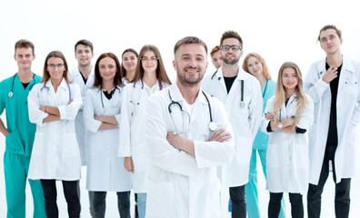 top view. a group of smiling doctors pointing at you.