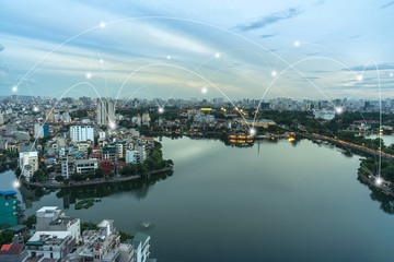 Naklejka premium Smart city and wireless communication network concept. Digital network connection lines of Hanoi city at West Lake or Ho Tay