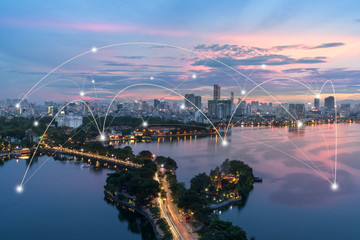 Fototapeta na wymiar Smart city and wireless communication network concept. Digital network connection lines of Hanoi city at West Lake or Ho Tay