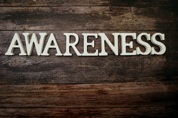 Awareness alphabet letters on wooden background