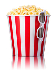 Paper striped bucket with popcorn and 3D glasses isolated on white background