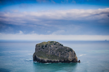 Huge cliffs near the island of Gastelugache. Basque country. Northern spain