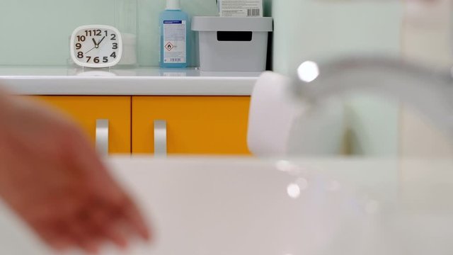 nurse washes hands before injection