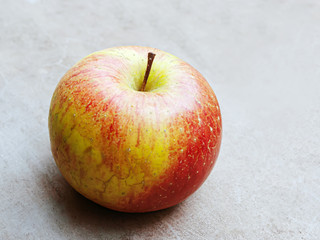 Close up of an organic apple fruit with outdour Background