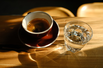 Stylish served specialty alternative black coffee. Filter pour-over coffee served in crystal glass...