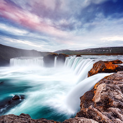 Gorgeous landscape with colorful sunrise on Godafoss waterfall on Skjalfandafljot river, Iceland