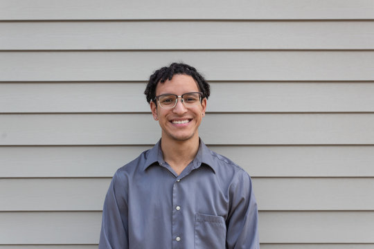 Young mixed race millennial male, big happy smile, facing camera, young professional, horizontal aspect - Powered by Adobe