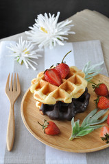 Two Flavor Waffles with Fresh Strawberries on Wooden Plate