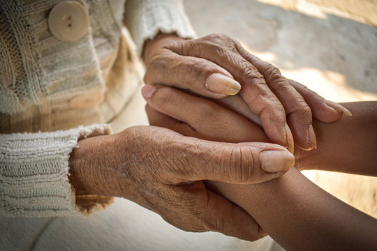  Hand Of A Woman Looking After The Elderly