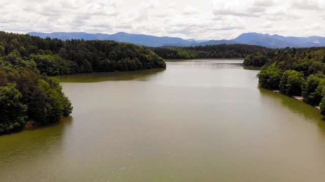 Smartinsko Lake, view of lake, forest and mountains. Famous for carps fishing.