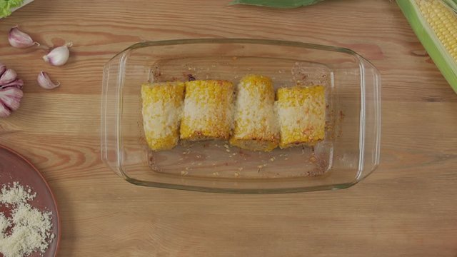 Baked corn on table table top background garlic parmesan cheese space for text