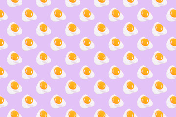 Fried eggs pattern on pink background.