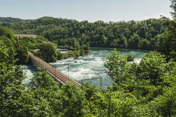 Fototapeta premium Nice landscape of the Rhine Falls, Switzerland. Massif impressive waterfall.