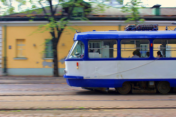 Blue tramway run high speed