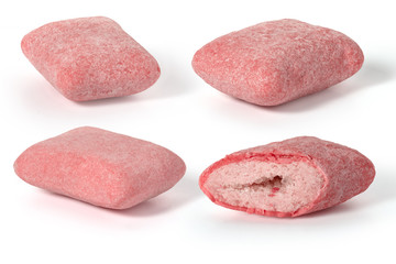 Four pads of pink strawberry chewing gum on a white background