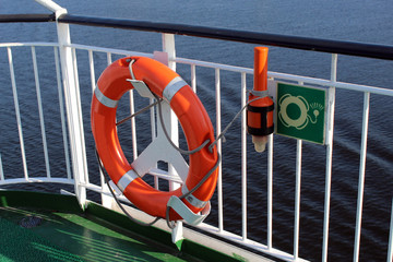 Orange lifeline on the deck of the boat