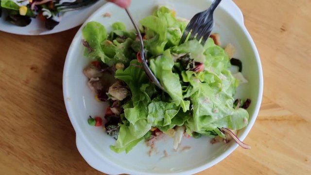 salad with tuna, salad dressing mix in dish on the table.