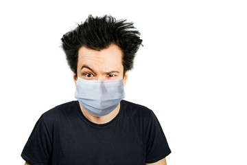 Unhappy, mad person wearing a protective face mask prevent virus infection or pollution on white isolated background