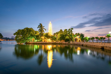 Fototapeta na wymiar Tran Quoc pagoda, the oldest Buddhist temple in Hanoi, at twilight. The famous destination travel in Hanoi