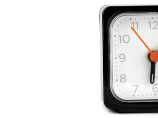 protruding half black alarm clock on a white background
