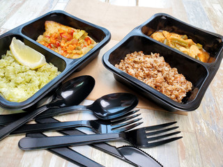 Plastic containers with useful food on the table. The concept of delivery.