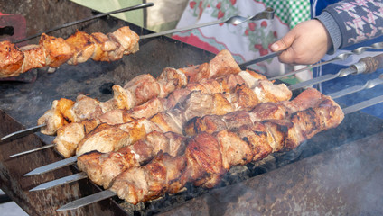 Traditional Russian shashlik on a barbecue skewer, cooking outdoor activities meat on skewers