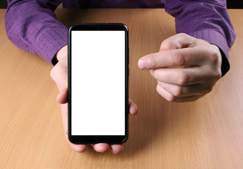 Man holds a smartphone and shows the viewer on the screen