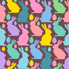 Multicolored Easter eggs and rabbits. Seamless pattern. Texture for fabric, wrapping, wallpaper. Decorative print. Vector illustration .