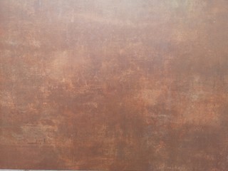 Copper color paint on cement wall has gray color and smooth surface texture concrete material background