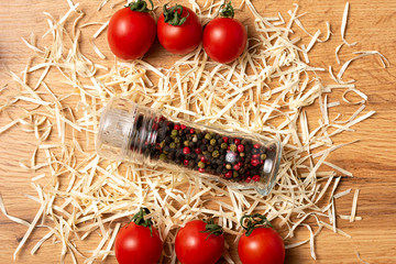 Pepper mill on wood background