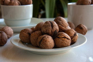 walnuts in bowl on wooden table