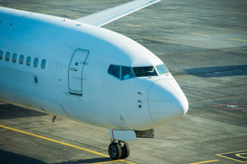 Big beautiful plane after flight standing on airport runway